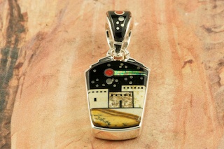 This Pendant is a work of art! Beautiful Starry Night in the Pueblo Design. Featuring Picture Jasper and Black Jade inlaid in Sterling Silver Pendant. Beautiful Fire and Ice Lab Opal Shooting Star! Reversible Pendant with Contemporary Sterling Silver Design. Free 18" Sterling Silver Chain with Purchase of Pendant. Designed by Navajo Artist Calvin Begay. Signed by the artist.